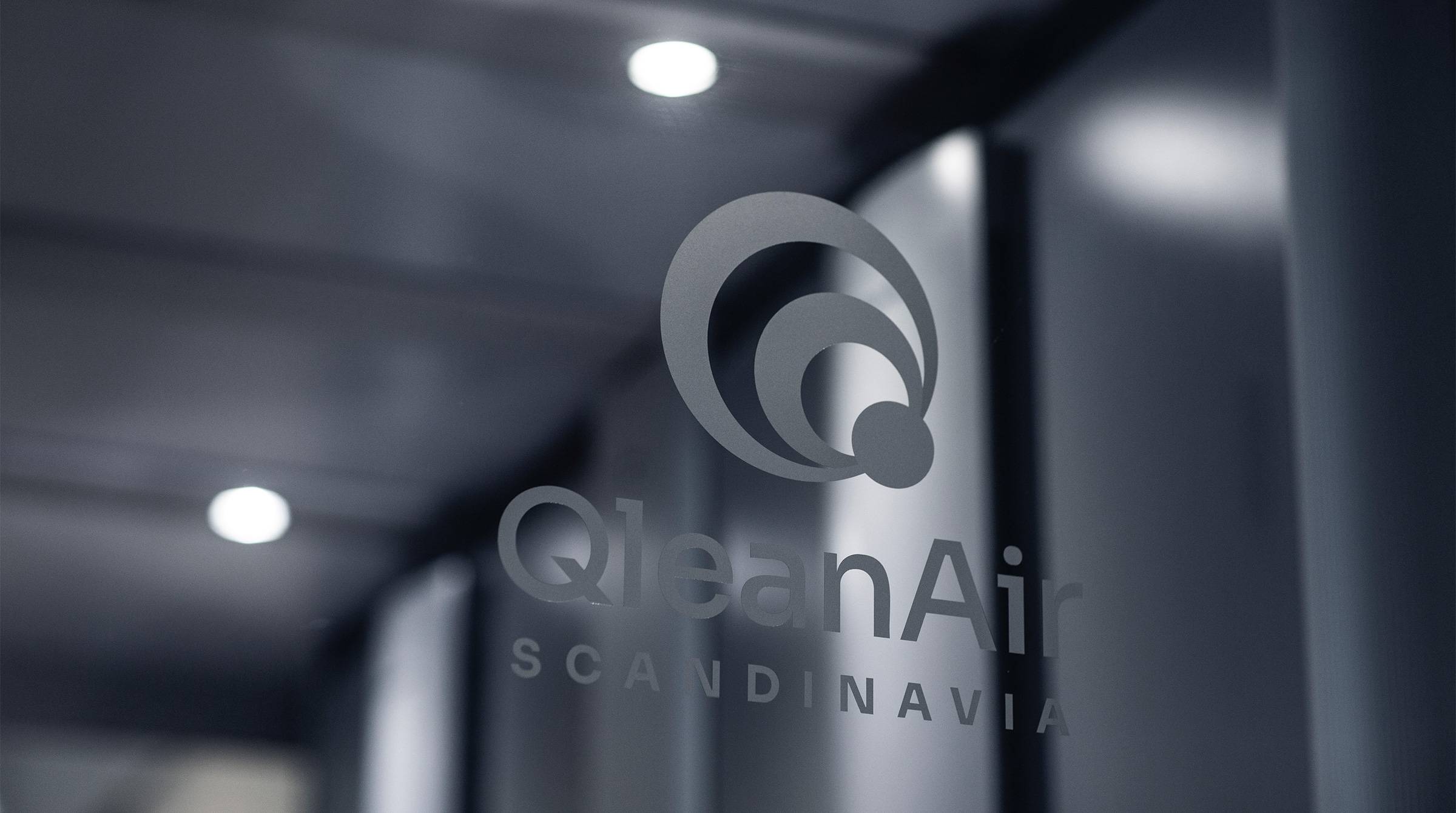 QleanAir logo on transparent glass